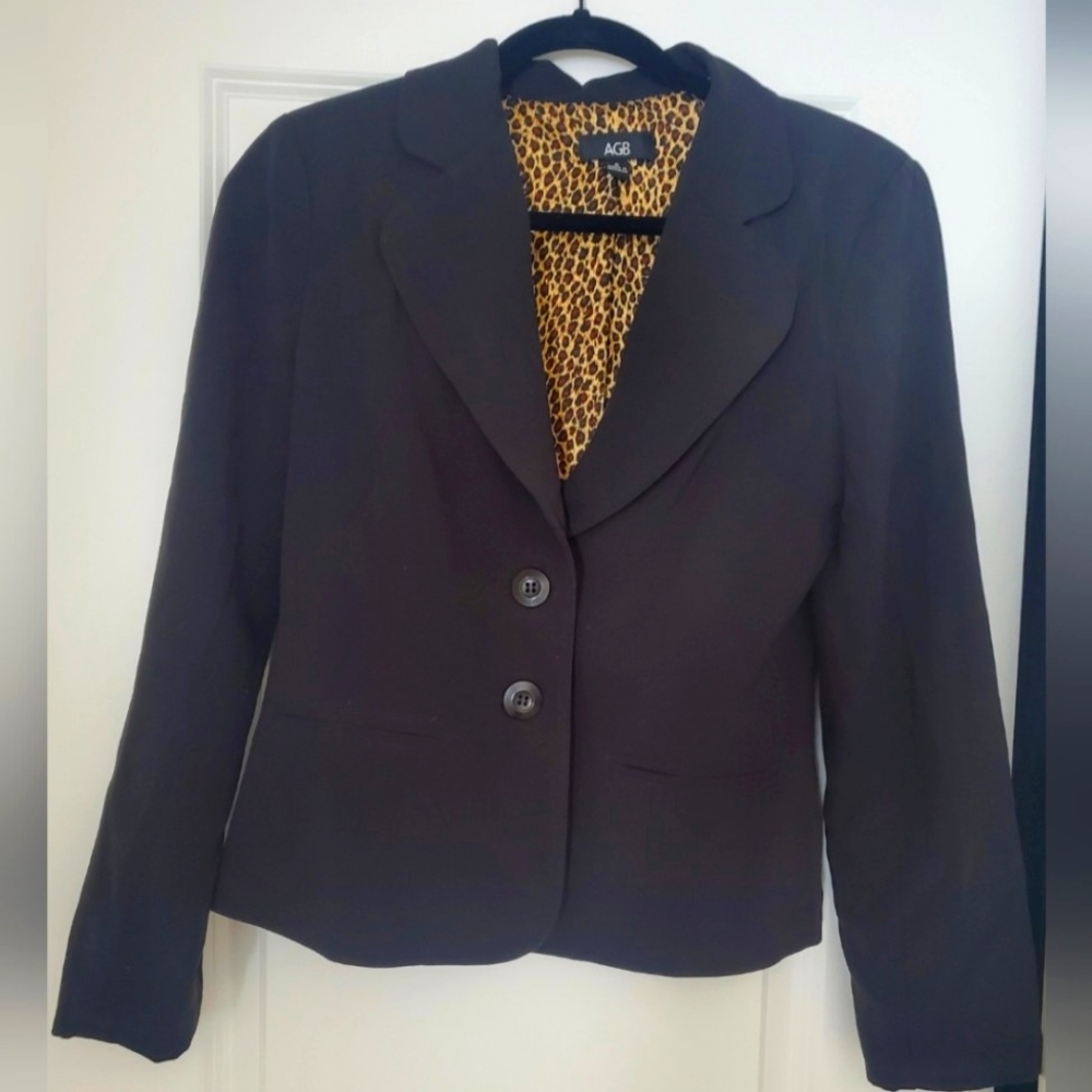 Black lined black 2 buttoned suit jacket with inner lined animal print.